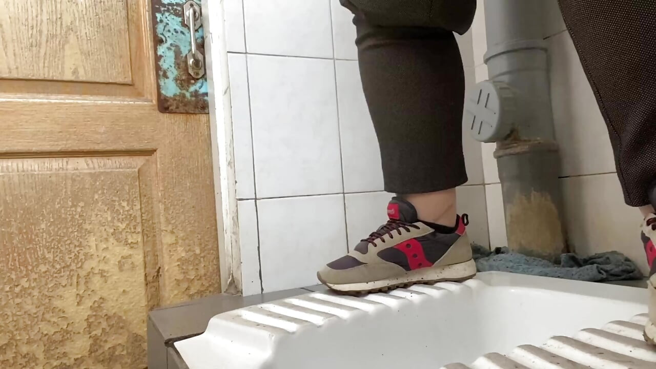 Mature milf pees in a hospital public toilet