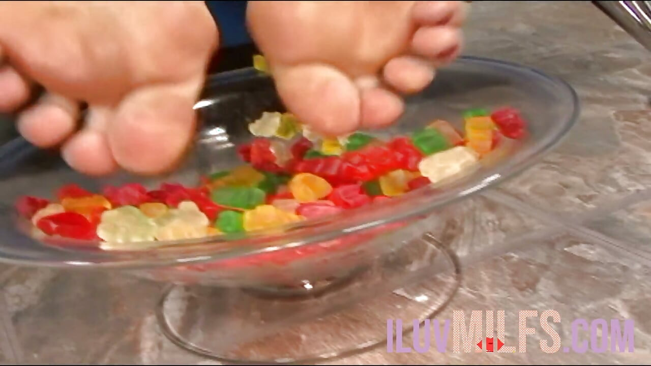Big tits milf dips her feet in gummies then gets fucked
