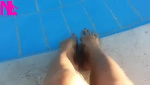 Barefoot Dangling in Swimming Pool Water