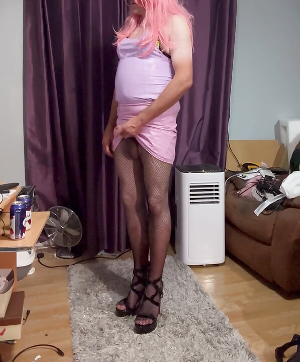 Dressed in pink pvc, fishnets and high heels and edging with lots of cum