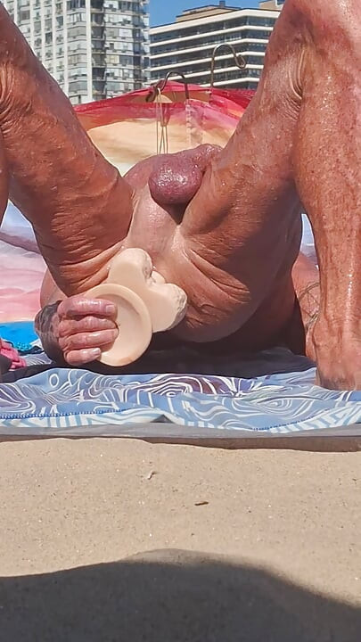 Key West oiled up using his new huge dildo at the beach