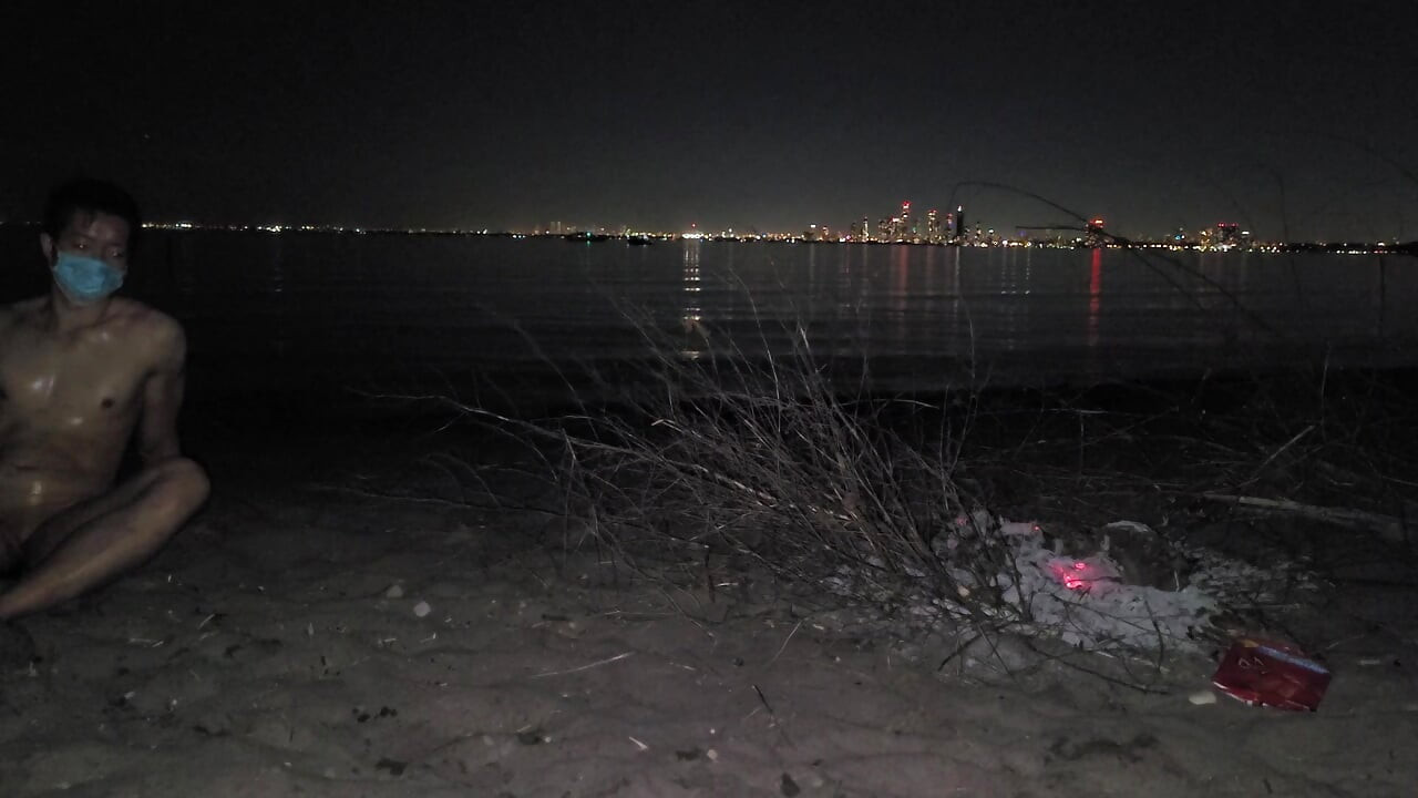 oiled masturbating and piss on the nude beach at night