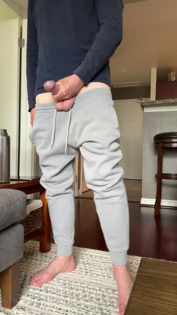 Showing my cock budge in gray sweatpants and then taking my cock out and stroking and showing it. Barefoot in gray sweats playing with my dick and jerking. Showing my thick mushroom head cock.