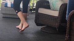 Wife and sister-in-law barefoot on the porch
