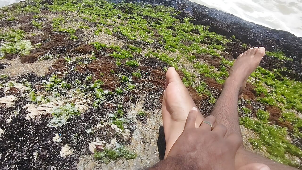 massaging my feet on the beach