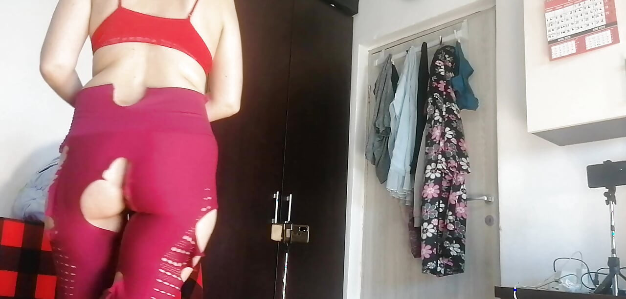 Sexy Latina Having Fun Trying on Clothes and Cutting Them