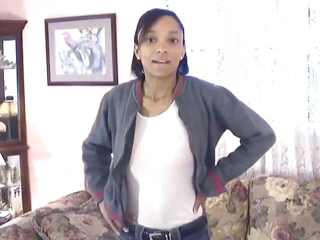Cute little black chick shows off her skinny beautiful bod on a couch