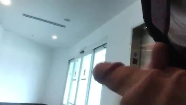 Jacking off by the elevators at work