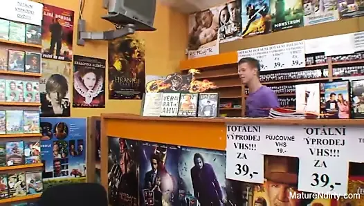 Sexy blonde mature fucks him in the video store