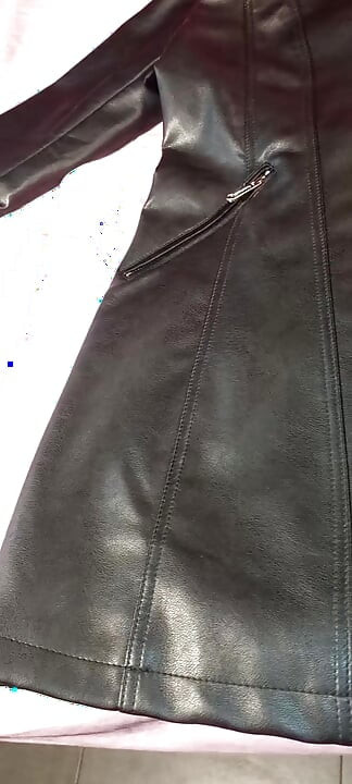Ejaculating on the lining of her black leather coat