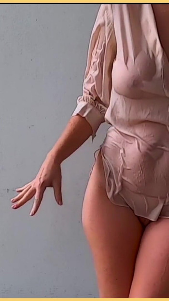 Captivating moment from "Wifey gets braless and wet in this hot office shirt"