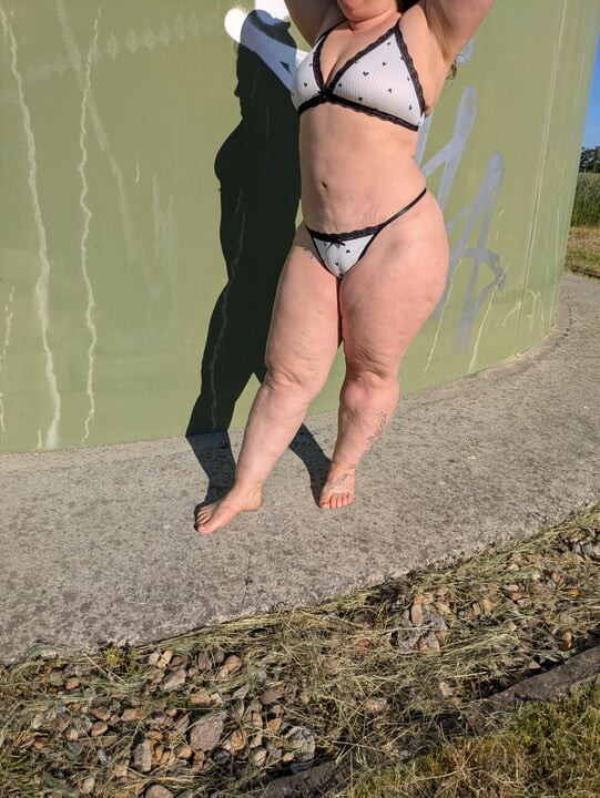 Curvy mom dancing in underwear outdoor