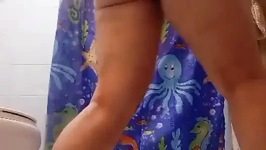 Latina Beauty Teases in the Bathroom