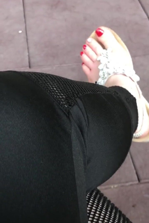 Sandals teasing outdoor with red toenails & toes wiggling