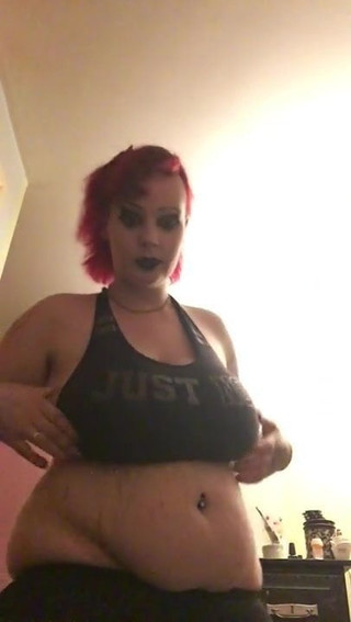 Goth girl plays with her tits and pussy