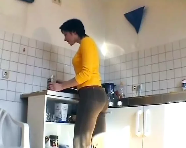 German slut plays with cucumber and sucks dick in the kitchen