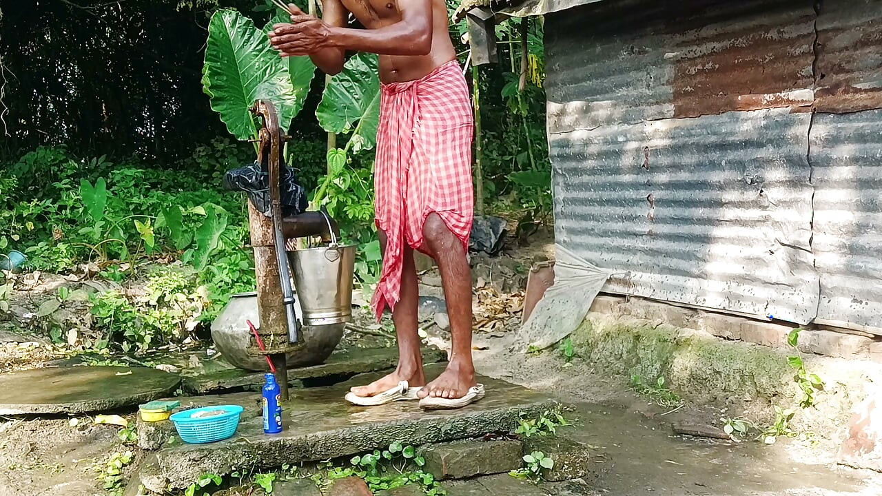 Desi young man bath Open place.