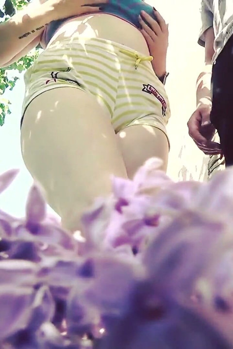 Tormenting and crushing a tiny man outdoors with our huge bodies and big feet