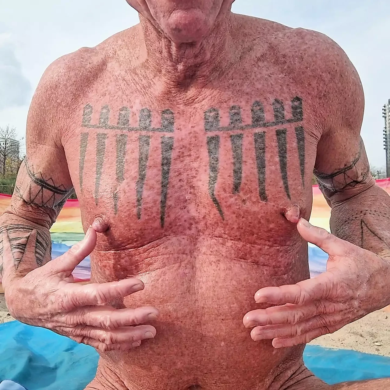 Playing with my nipples at the beach