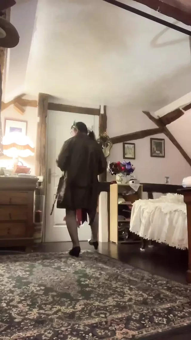 In an outfit with a little green nightie and an overcoat for an evening