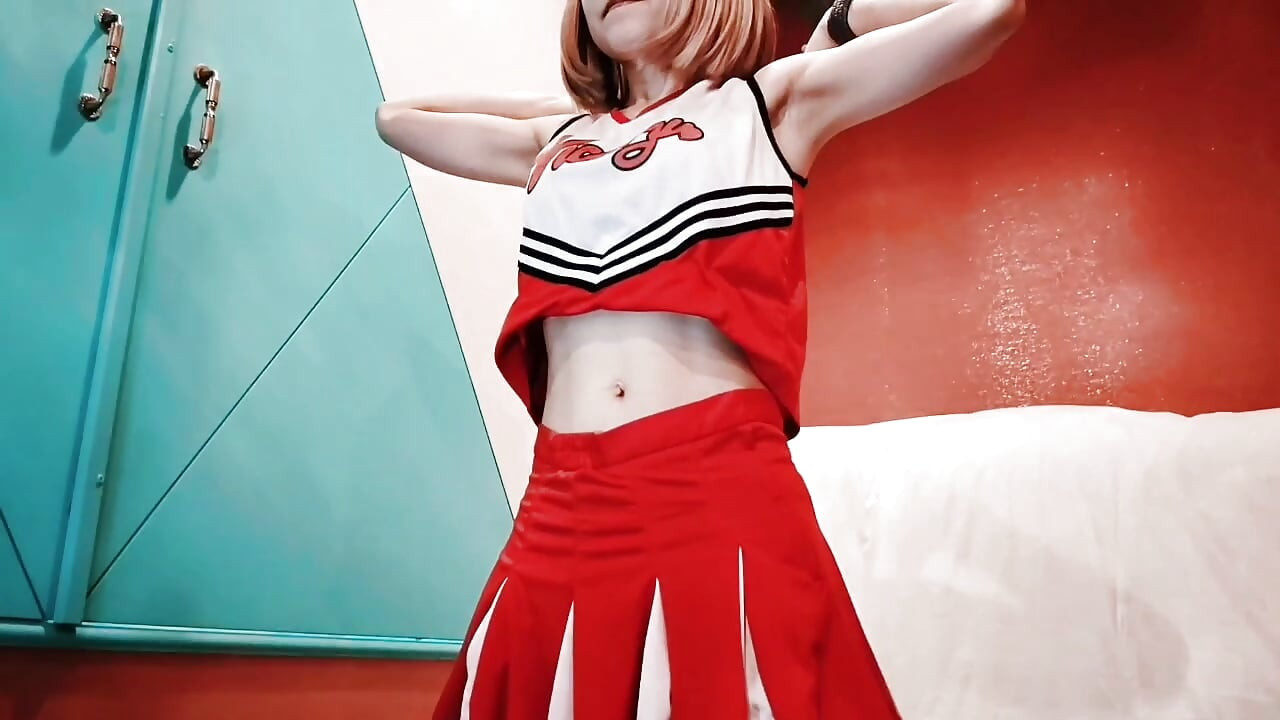 A cute, busty married woman does exercise 1 in an erotic cheerleader costume. Home made amateur Private Shoot