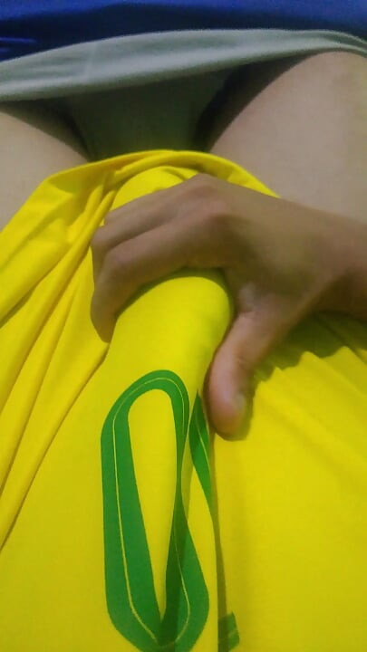 Pov young Brazilian guy masturbating big thick dick wearing the Brazilian national team uniform