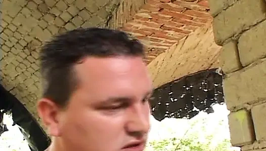 Old woman plays with her pussy outside and gets hard anal fuck from a tattooed guy