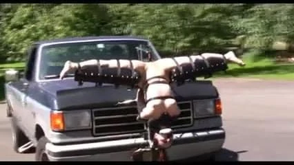 tied upside down with open legs