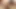 Brunette ladyboy with sunglosses pulls out a trimmed dick in