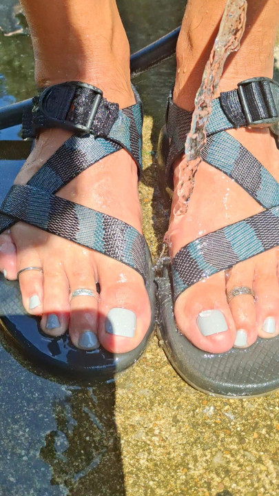 Washing my feet and sandals after walking in the creek