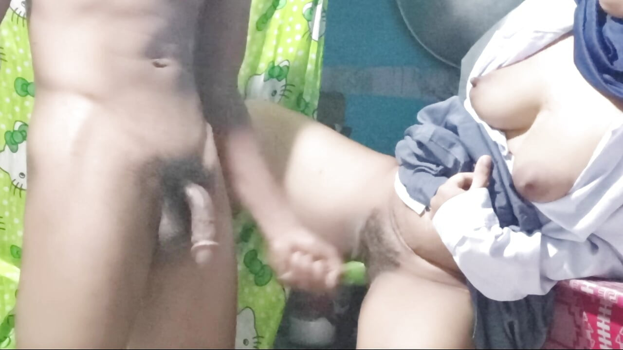 School girl masturbates in the kitchen using cucumbers