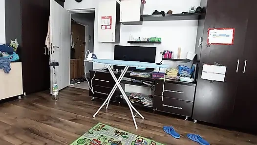 Sexy brunette doing naked chores around the house.