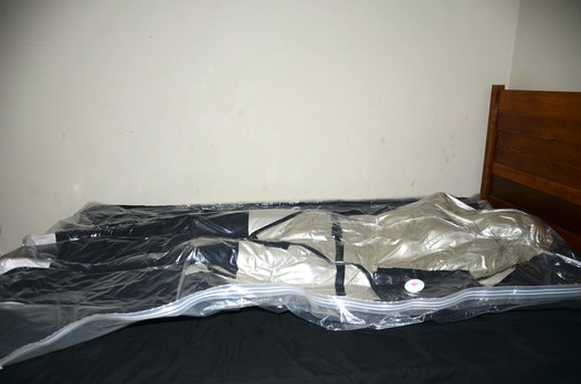 Aug 24 2023 - VacPacked with my PVC aprons, silver latex jacket and thick quilt