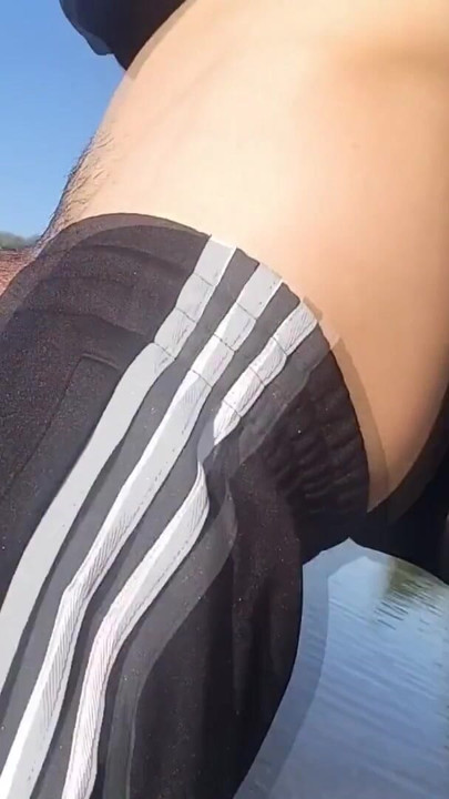 Who will spot this twink in a black and white adidas tracksuit, flashing his cock in public going commando freeballing… | Clip 1