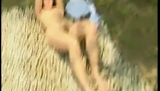 Surprising naked girl at a sunbath