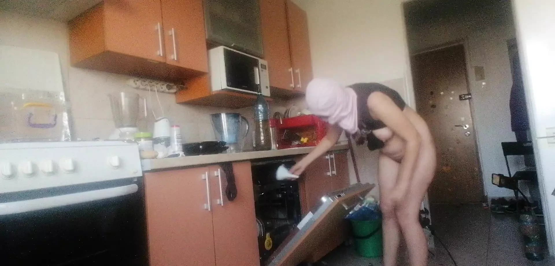 Sexy nude wife preparing food in the kitchen. Hairy brown hair, big ass, big tits