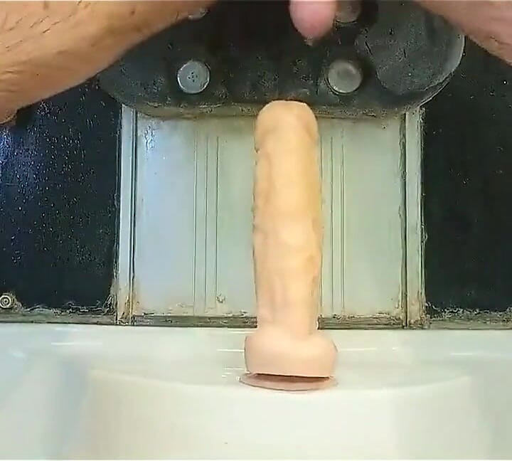 Mulatto Jumps on a Dildo and Pisses