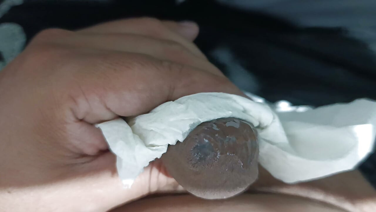 I start jerking off hard until I cum really good into my hand using a tissue