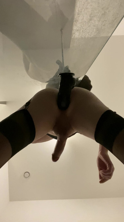 Taking a bbc dildo while standing