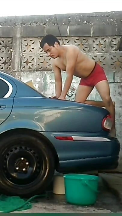 Jesus in red boxer washing his jaguar car