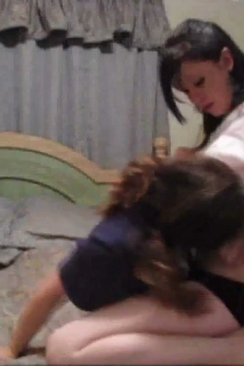 Two hot brunette girl kissing on the bed