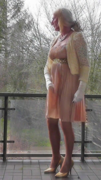 Memorable moment from "Wanking On A Winday Day In My Shiny Pleated Satin Gown"