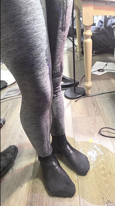 Gray leggings wetting leaves me standing in puddle