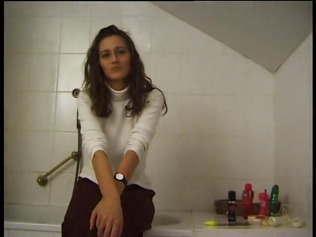 Stunning brunette babe seducing her pussy with vibrator in the bathroom