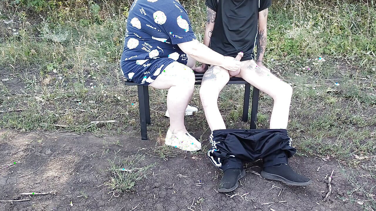 A girlfriend in a public park jerks off my dick until I cum