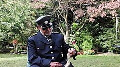 Military officer enjoys smoking his pipe and getting off