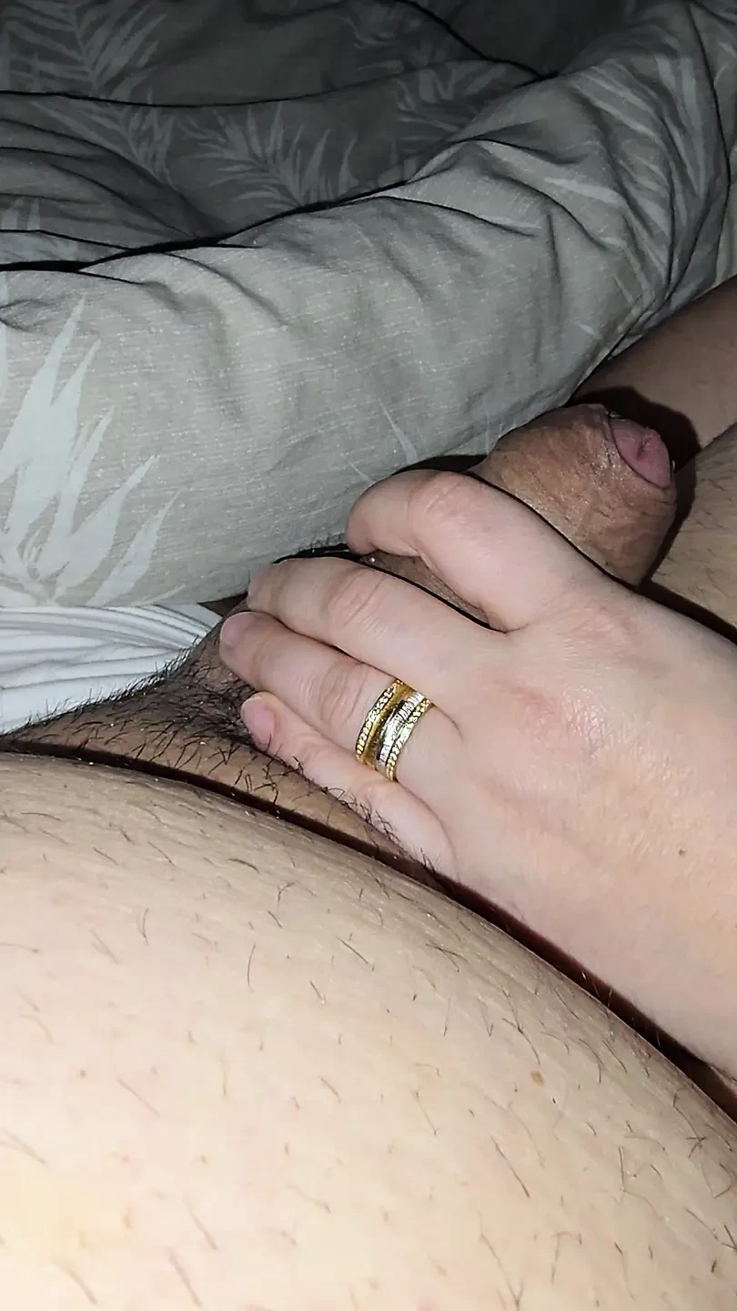 Slutty step mom pulled step son dick out for a handjob in bed