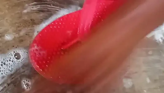 Getting a bath in traditional bathroom in village.