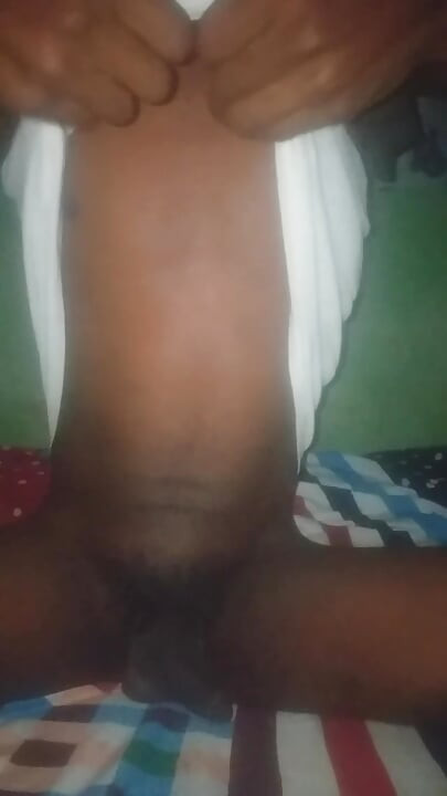 Flashing his big black ass.