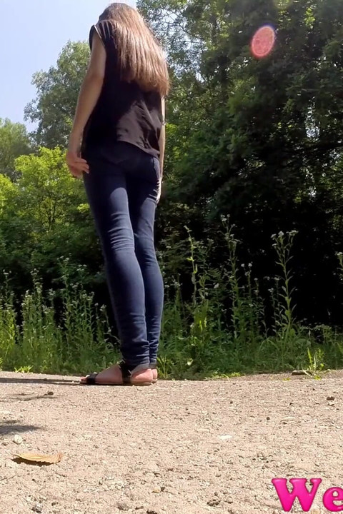 Wide open legs peeing outdoor and Desperate to pee, she has to pee in front of the car in her jeans